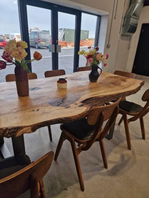 A live-edge ash table with chairs at Gorse Bakery